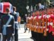The coffin passes the Albanian Guard of Honour, Crown Copyright, all rights reserved